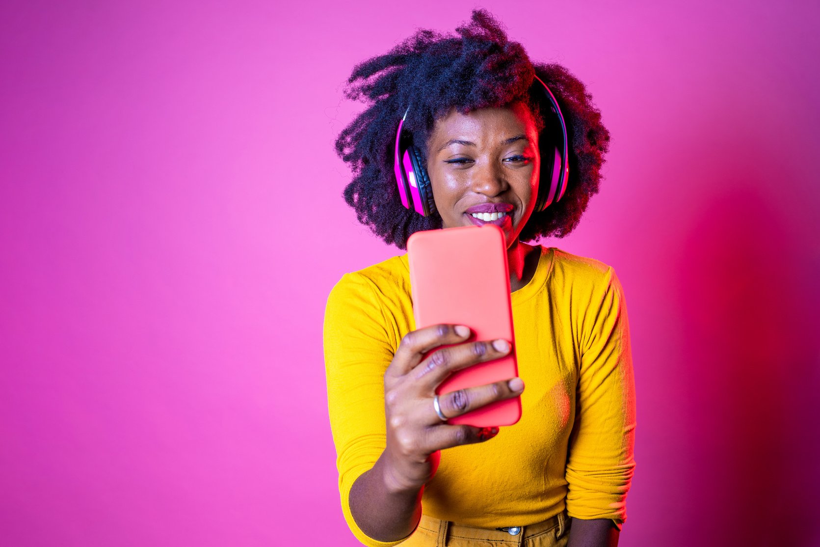 Young Beautiful Black Woman Taking Selfie on Pink Background - I